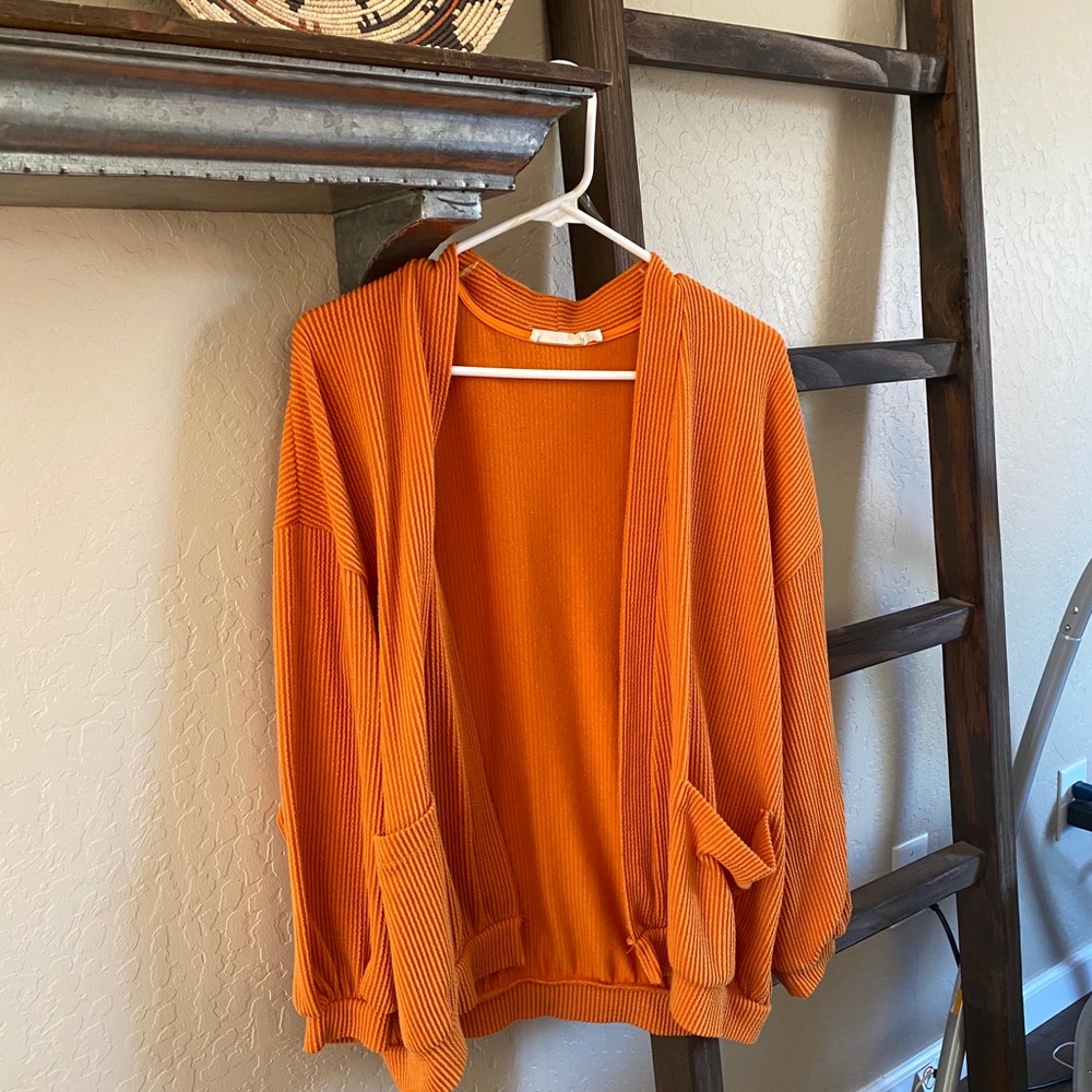 Lush orange textured cardigan.